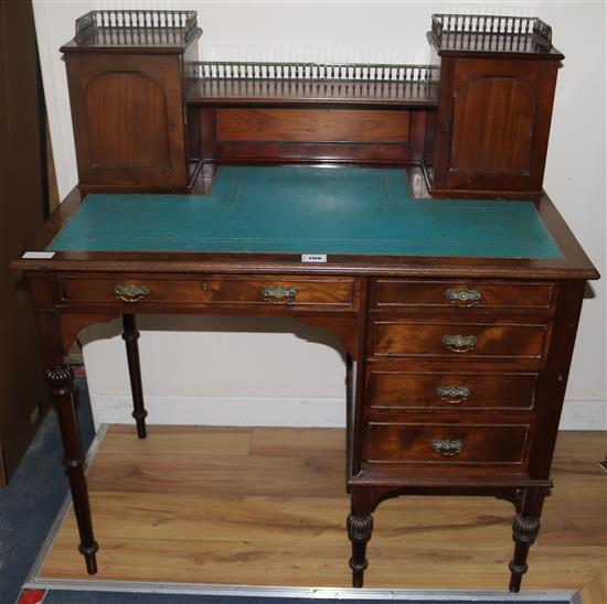 An Edwardian walnut desk, Straughan & Co, W.100cms